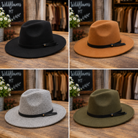 Four felt wide-brim fedora hats arranged in a 2x2 grid on a wooden table, each with a black ribbon band and small gold button. The hats are shown in black, camel brown, light gray, and olive green.