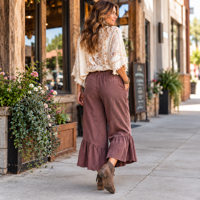 Back view of the Mulberry Ruffle Bottom Mineral Washed Pants by Easel