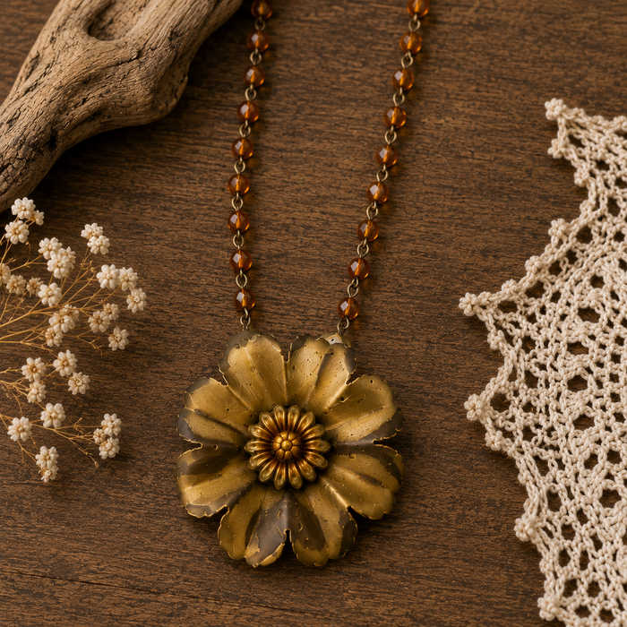 Gold flower boho statement necklace with amber beads styled on rustic wood