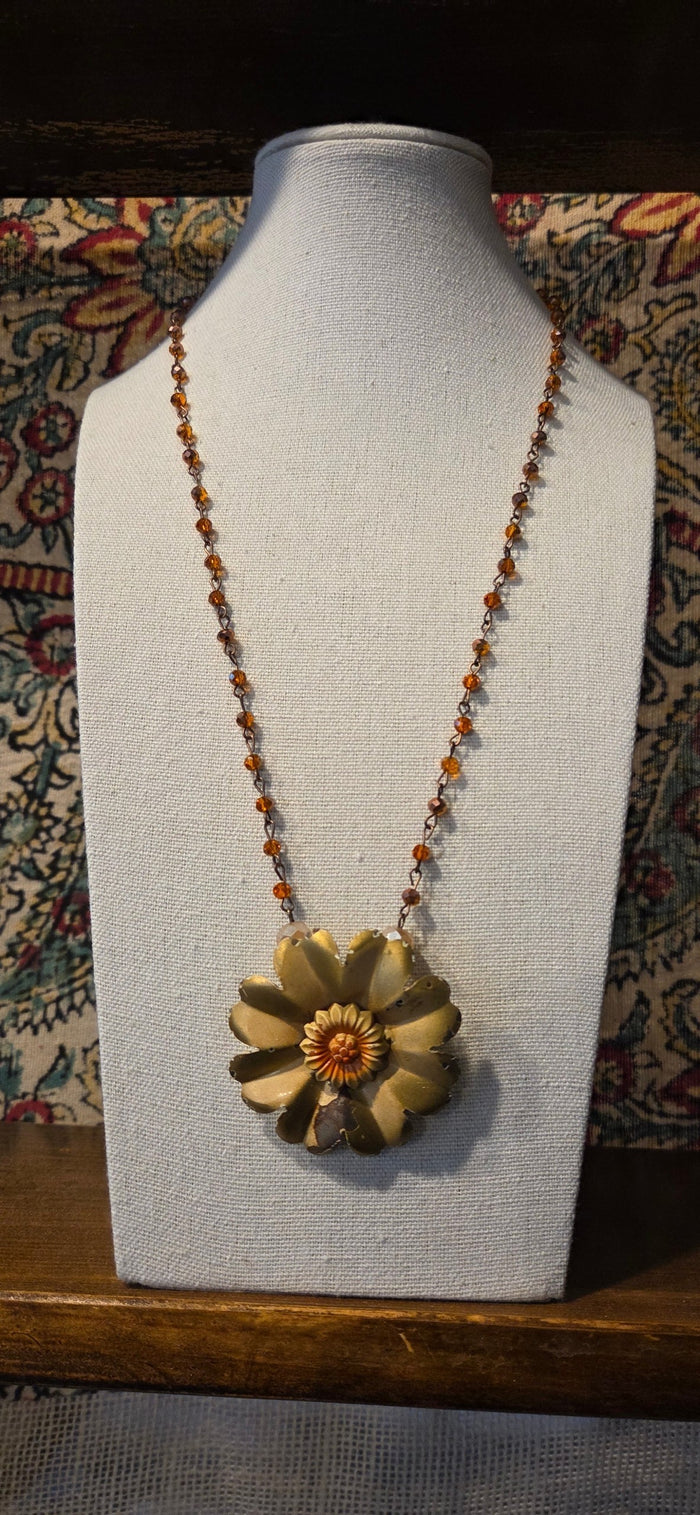 Handmade boho statement necklace with vintage-style gold flower pendant and amber beaded chain